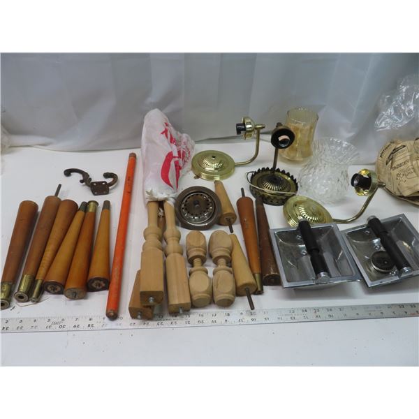 table legs , light fixtures , sink drain , toilet paper holders ,  light shades