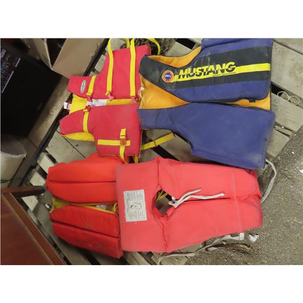 lot of 4 life jackets various sizes