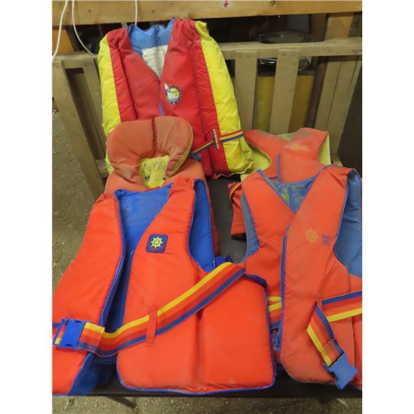 lot of 5 life jackets various sizes