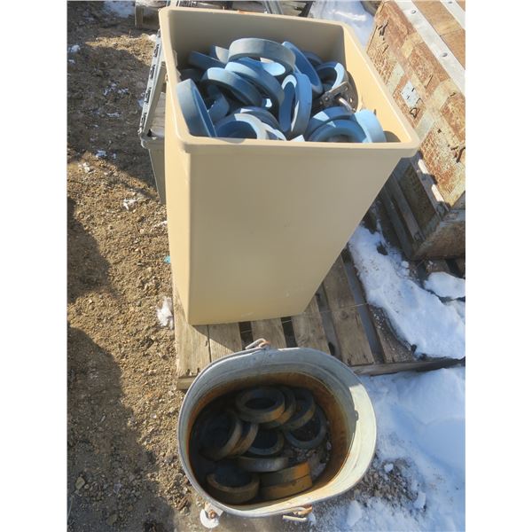 garbage can and galvanized mop pail full of bowling pin rings