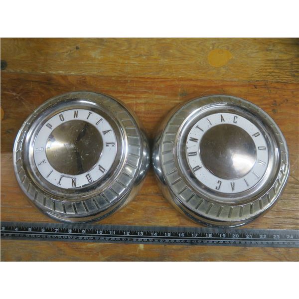 2 Pontiac moon hub caps