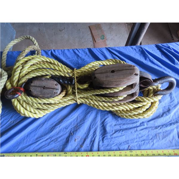 rope hoist set to work and comes with extra rope vintage and functional
