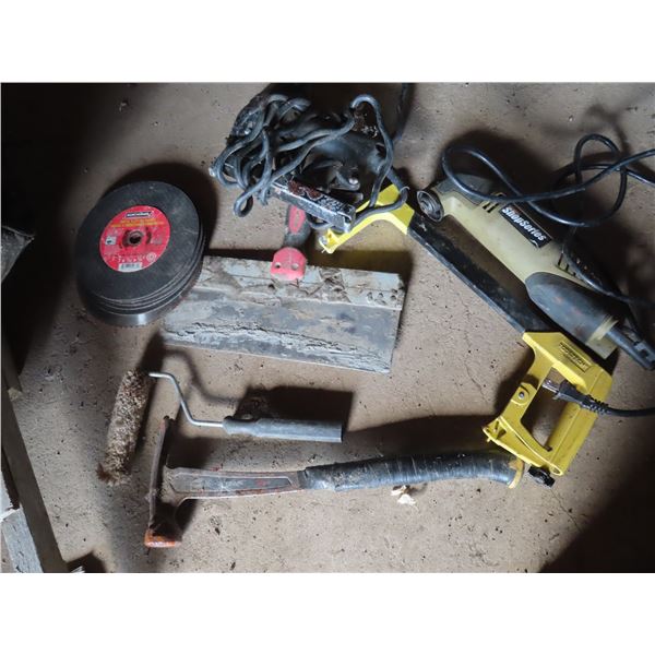electric stapler , grinder , assorted tools , weathered bag