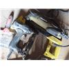 Image 2 : electric stapler , grinder , assorted tools , weathered bag