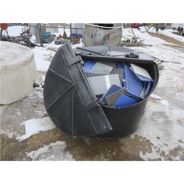 large garbage bin full of interlocking plastic tiles