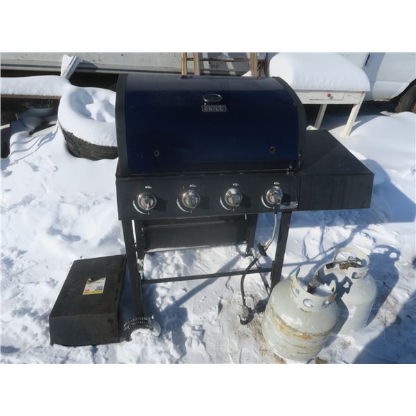 barbeque with 2 propane tanks - 1 partially full