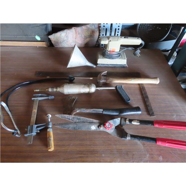 lot of tools , hatchet , square , c-clamp , hammer