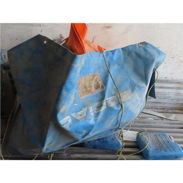 large plastic heavy duty bag with two tarps and air mattress