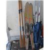 Image 2 : lot of water skis , cross country skis , and paddles