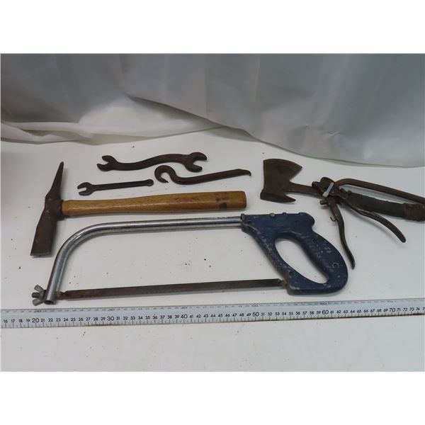 gray hacksaw , old tools and hatchet