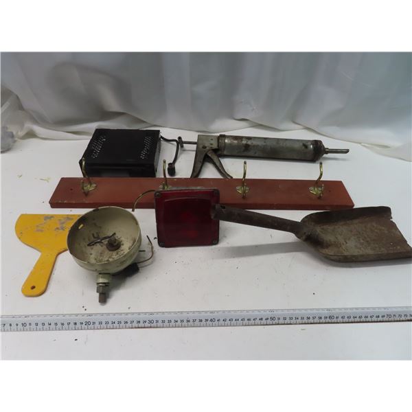 Toyota deck , coat hanger , coal shovel , antique caulking gun