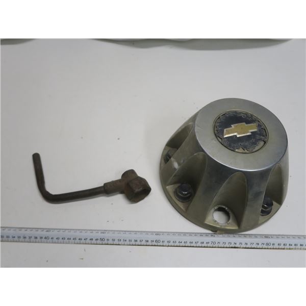 GM 1 ton hub cap and antique wrench
