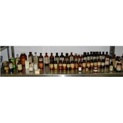 Lot of old medicinal bottles and boxes: including- Balsam Fir, Tannic acid, vitamins, elixirs, chemi