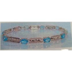 Blue Topaz Bracelet 10 K yellow gold- blue topaz are oval, faceted approx. 3.00 carats, transparent 