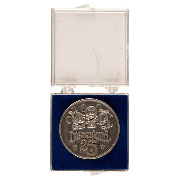 A Disneyland 25th Anniversary Medallion.