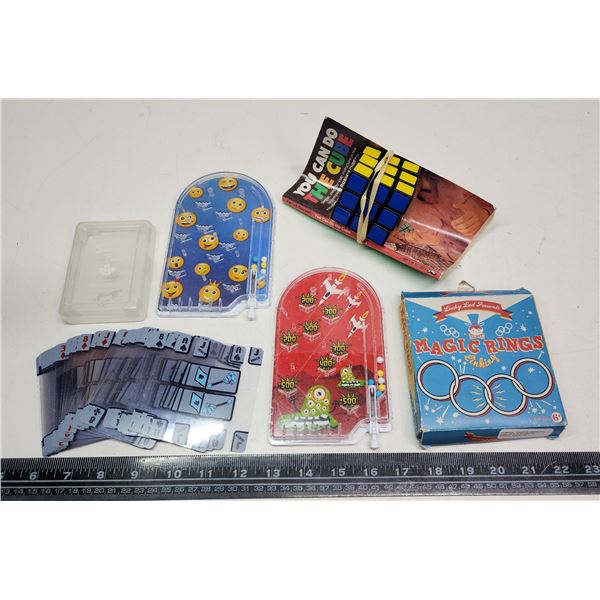 Puzzle games - Rubix cube, hand held pinball, deck of cards, etc.