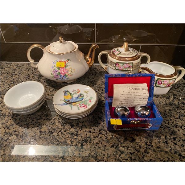 Assortment Of Asian Style Dishware And Chinese Medicine Balls