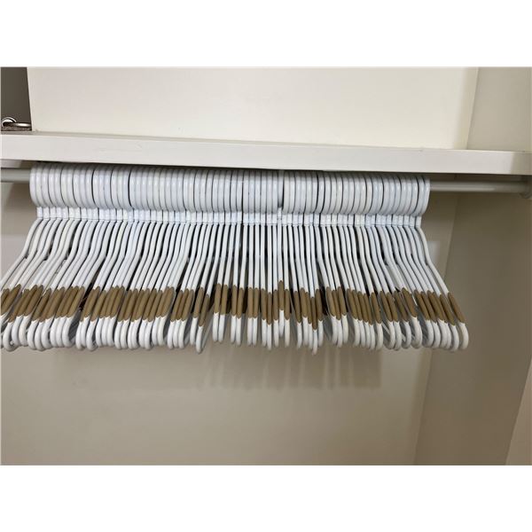 Approximately 62 Plastic Hangers with Rubber Grips