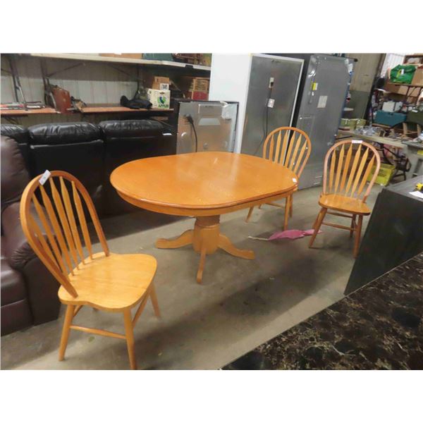 Oak Pedestal Table 30" x 41" x 59" included is (1) 17" Leaf & 3 Chairs