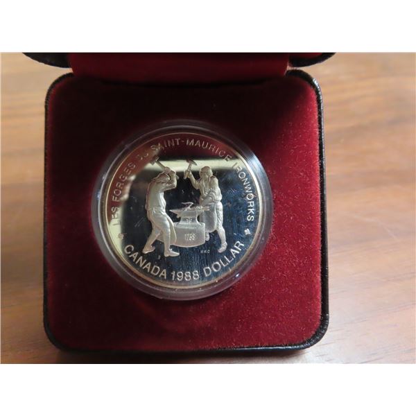 1988 Canadian Silver Dollar Commemorates The First Heavy Industry In 1988-canadian-silver-dollar-commemorates-the-first-heavy-industry-in