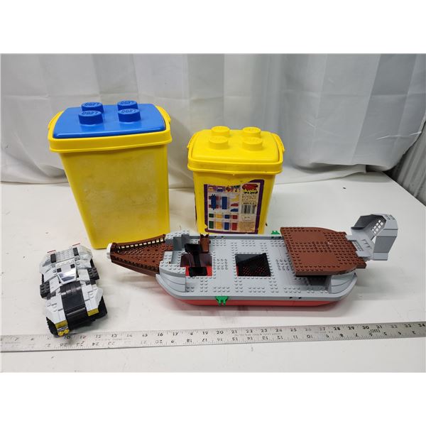 Legos lot - Boat, bomadier, 2 Lego containers - filled with Lego pieces