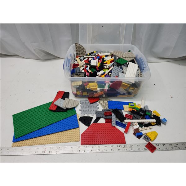 Mix of Legos and Mega Bloks, in container