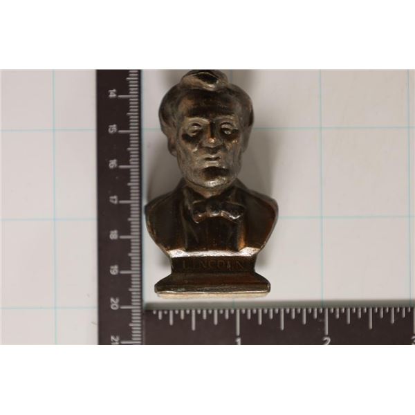 ABRAHAM LINCOLN SMALL METAL BUST. 1 3/4 X1 X2 1/2 