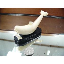 Old ivory whale 5" carved from a whale tooth mounted on a wood base