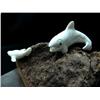 Image 1 : White ivory killer whale chasing seal mounted on whale bone on wood base- 6" length, 4" height (3)