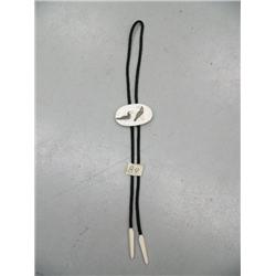 CHOICE on 2 bolo ties: J. Mayac with 2 puffins; fossilized ivory of elephant and drops are kayaks by