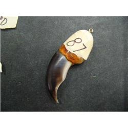 Polar bear claw pendant mounted with ivory by Roger Silook