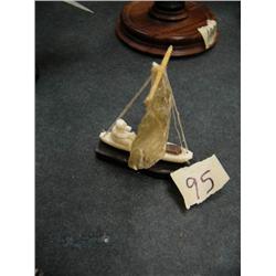 Baleen, ivory and seal gut Eskimo hunter in ivory boat by Thomas Pushruk