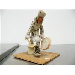 Seal skin doll with wood face and seal gut drum