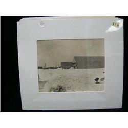CHOICE on 11 original photographs of Alaska: (b) F. H. Nowell photo of East front street in Nome, Al