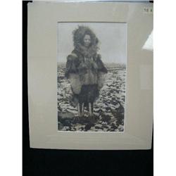 CHOICE on 8 original photographs of Alaska: (d) lady in striped seal pants and fancy muskrat parka(3