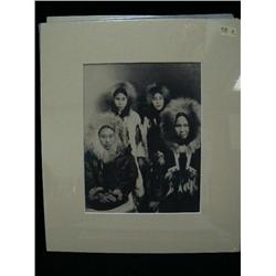 CHOICE on 8 original photographs of Alaska: (e) Eskimo family portrait in fancy parkas, girl on fron