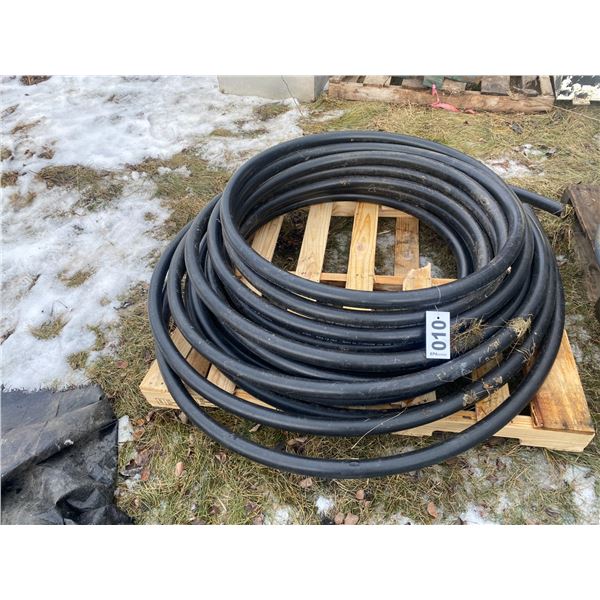 Roll of black plastic pipe