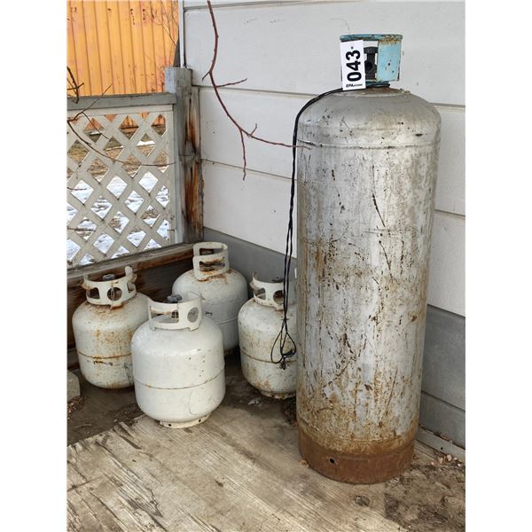 100 lb. propane tank full, & 4- small tanks