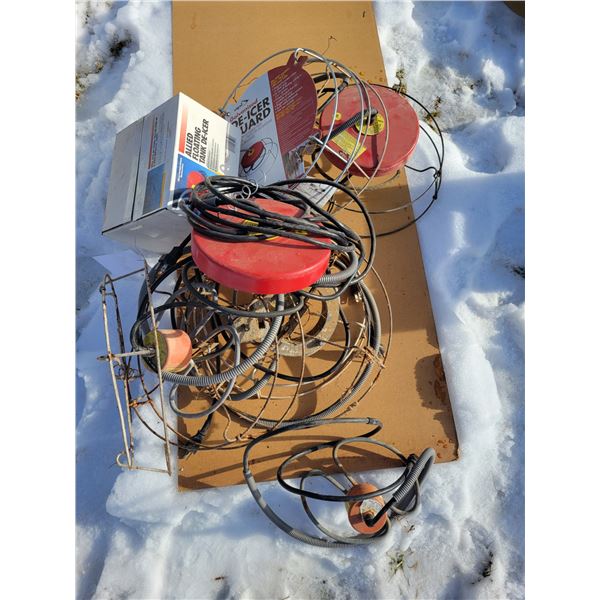 1 floating tank heater, new; 1 new de-ice guard; 4 submersible tank heaters, new; 3 used submersible