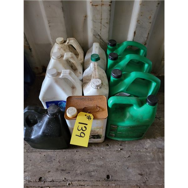 Five 5-liter 5W-30 motor oil, 4 unopen; 1 tin turpentine, unopen; 5-liter trans-hydraulic fluid, uno