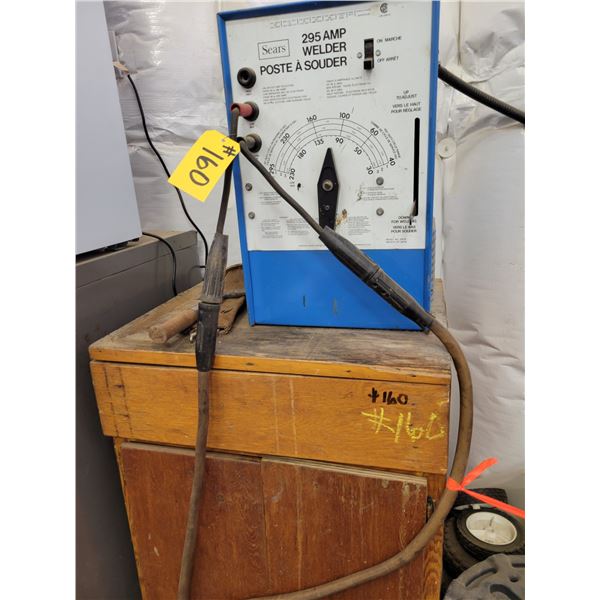 295 AMP electric welder with cables; leather rod pouch; chipping hammer; wood cabinet 22" x 28" x 37
