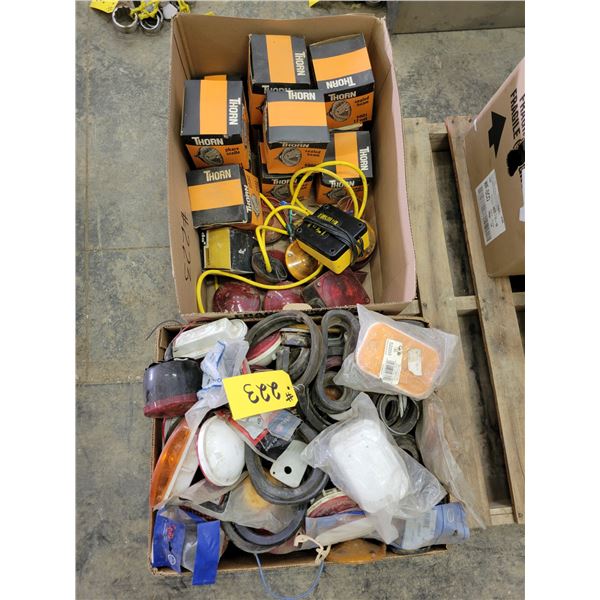 Numerous headlights; numerous trailer lights