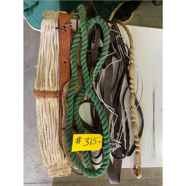 2 Western hat holders; 2 saddle cinches; braded leather reins; misc. items