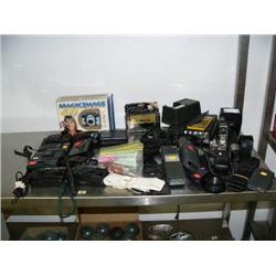 Lot of: 9 cameras; stereo cassette player; flash attachments; and various related items (94)