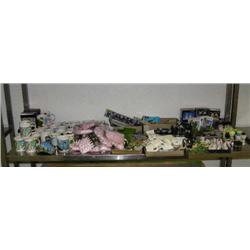 Whole shelf of Alaskan cups, laces, and various knick-knacks (94)