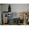Image 2 : Shelf of nautical items: 5 model ships, 2 large lighthouses, 5 smaller lighthouses, 2 "WELCOME ABOAR
