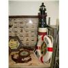 Image 4 : Shelf of nautical items: 5 model ships, 2 large lighthouses, 5 smaller lighthouses, 2 "WELCOME ABOAR