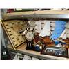Image 2 : Shelf of nautical items: 6 model ships, framed knots, 1 large lighthouse, 5 smaller lighthouses, set