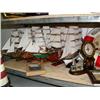 Image 2 : Shelf of nautical items: 5 model ships, "WELCOME ABOARD" lifesaver sign, bookends, 5 smaller lightho