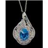 Image 1 : Blue Topaz and Diamond Pendant and Chain 14 K yellow gold- blue topaz is oval, faceted, approx. 1.00